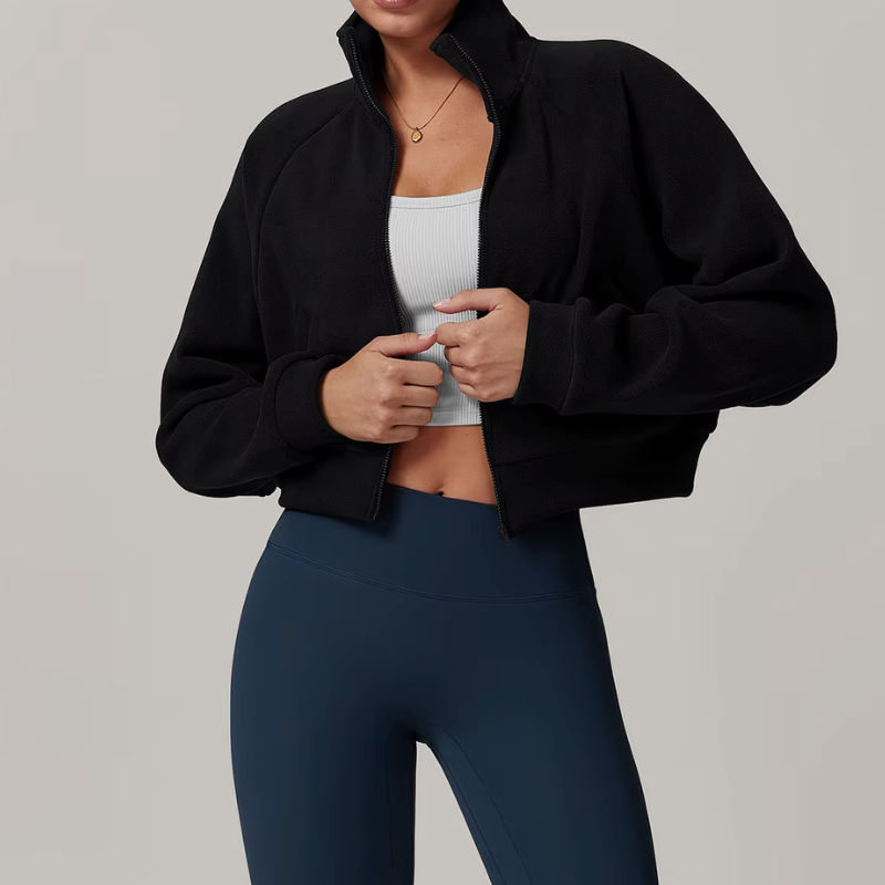 Side profile of women's fleece zip-up jacket with slit pockets