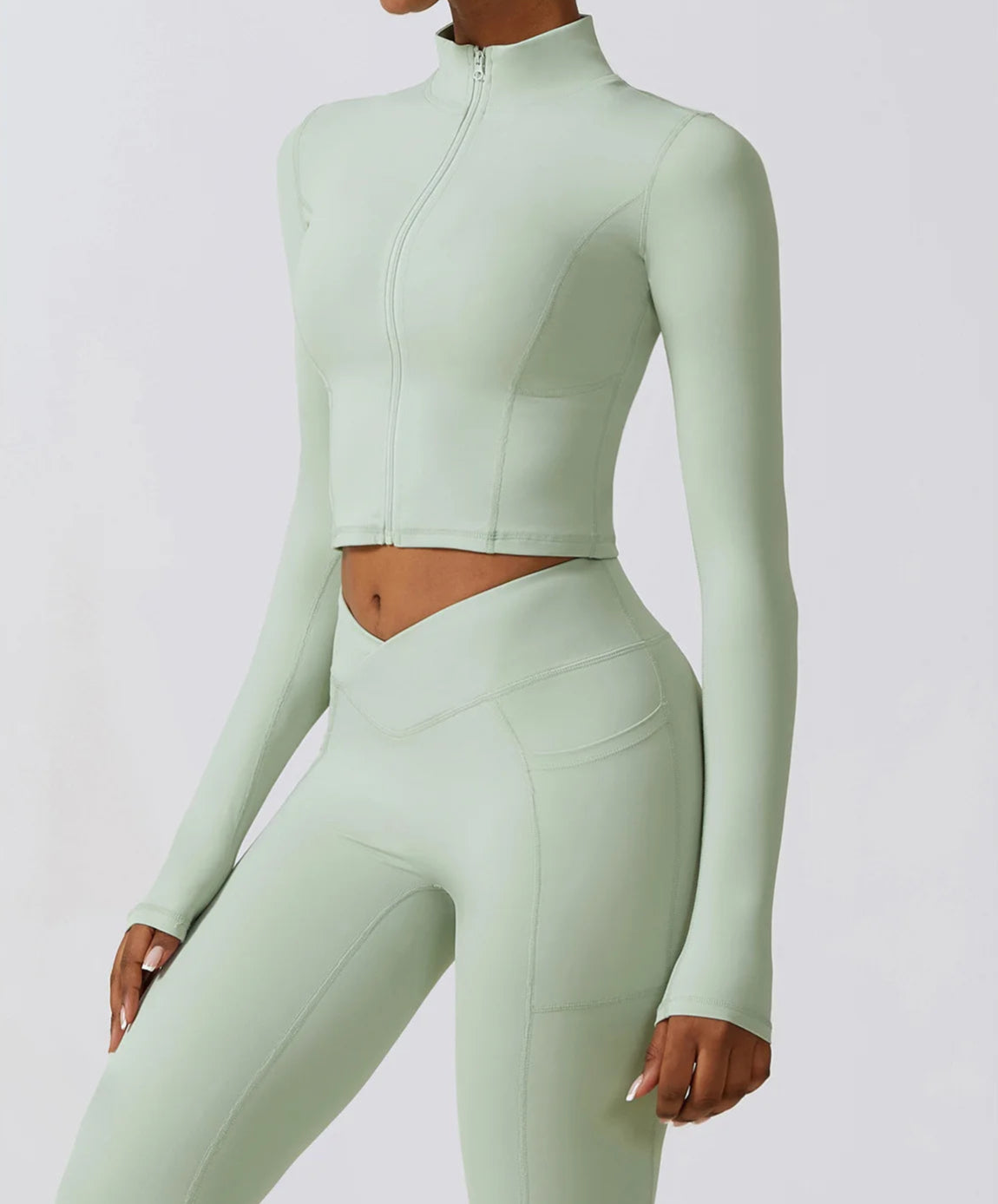 Ergonomic full-length zip running top for women in light green