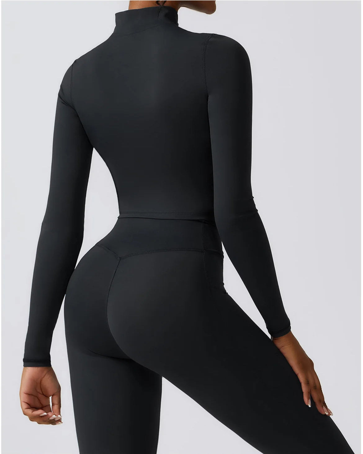Ergonomic full-length zip running top for women in black