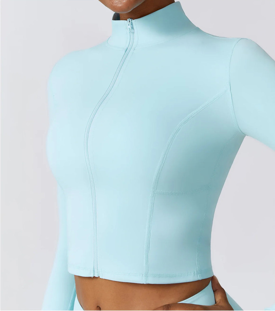 Ergonomic full-length zip running top for women in light blue