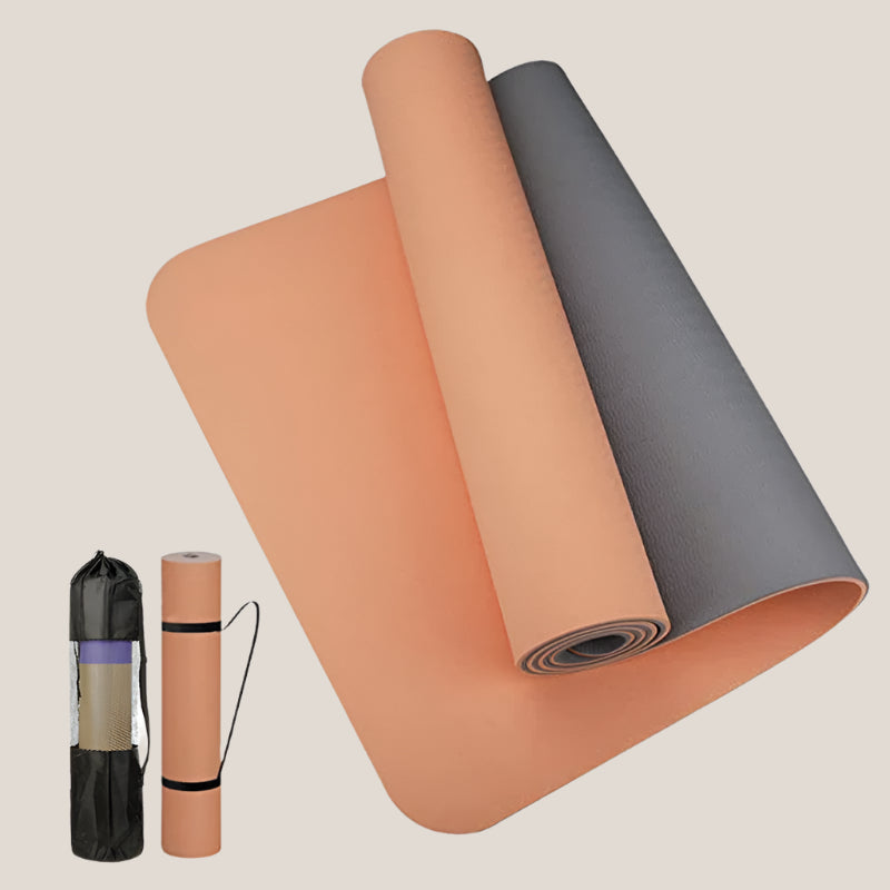 Anti-skid yoga mat rolled out with a sleek black design on a wooden floor.