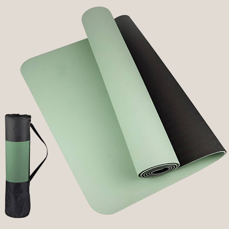Anti-skid yoga mat rolled out with a sleek black design on a wooden floor.