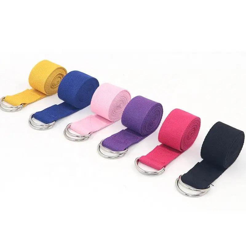 Durable multi color yoga strap rolled on a white surface, perfect for stretching and flexibility exercises