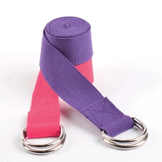 Durable purple yoga strap rolled on a white surface, perfect for stretching and flexibility exercises