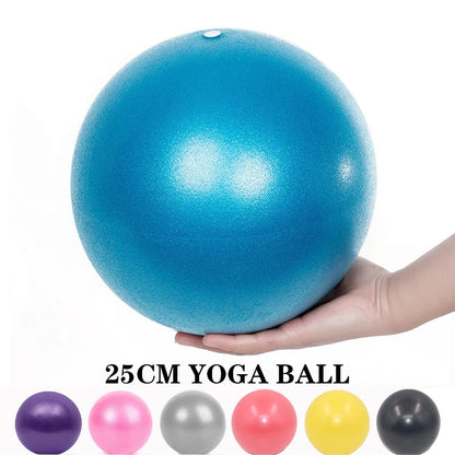 Compact and durable yoga ball enhancing flexibility during a pilates class.