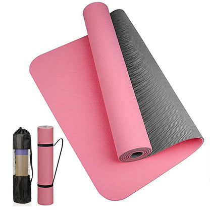 Anti-skid yoga mat rolled out with a sleek black design on a wooden floor.