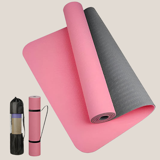 Anti-skid yoga mat rolled out with a sleek black design on a wooden floor.