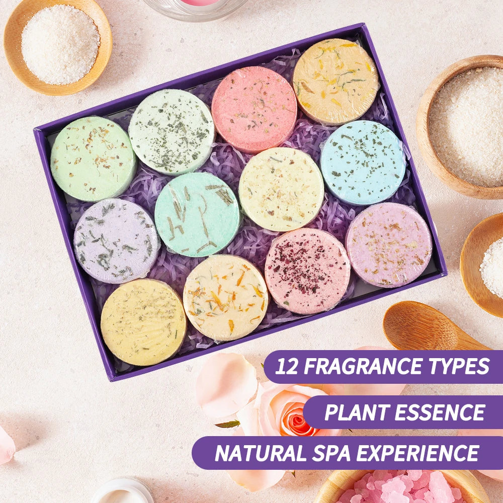 A pack of 12 all-natural shower steamers displayed with eucalyptus leaves and lavender flowers.