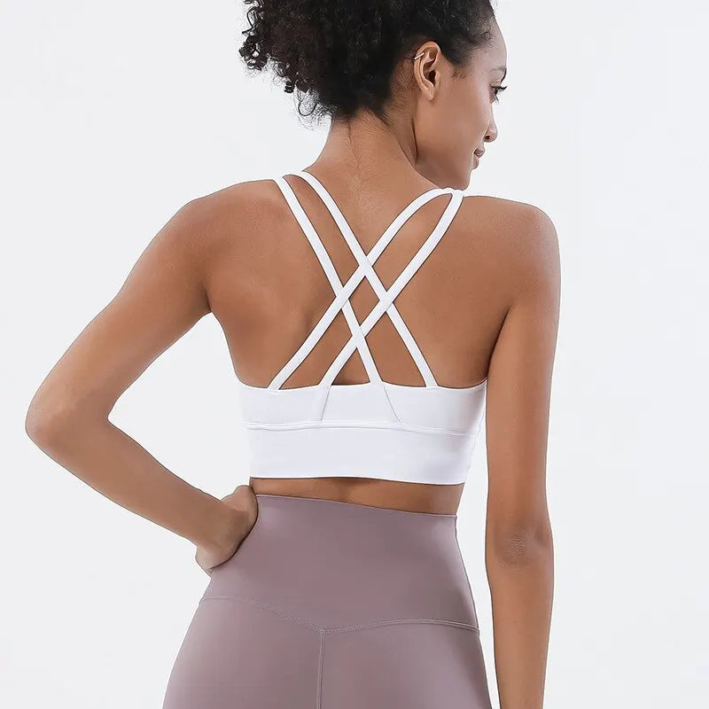 Double cross-back straps on a medium-impact sports bra for women.