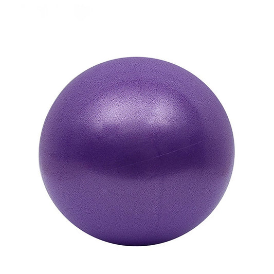 Inflatable Yoga Pilates Ball in purple color placed on a yoga mat.